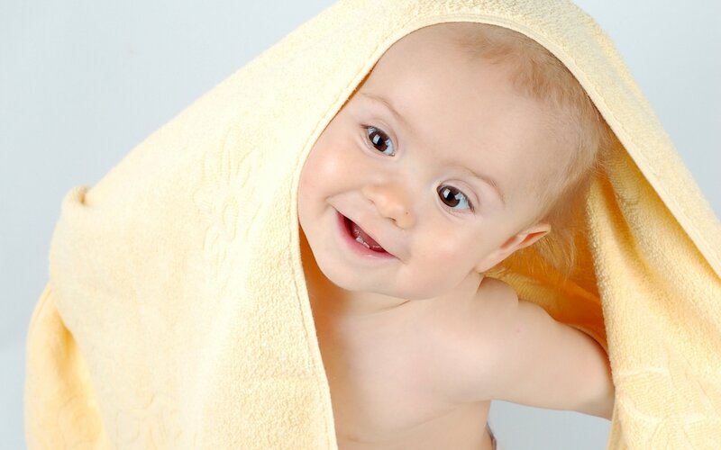 Baby Wrapped in Towel — Yellow, Happy