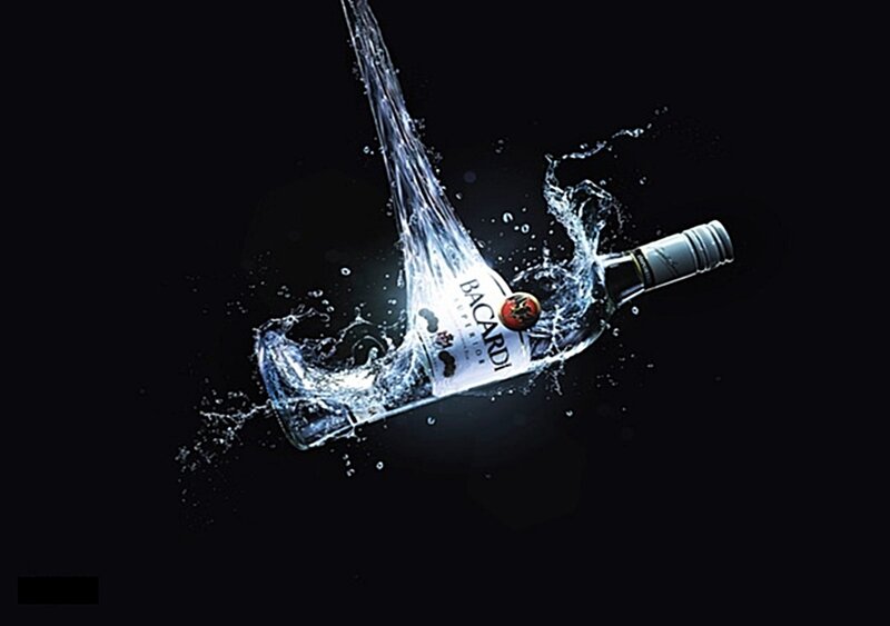 Bacardi bottle in water splash