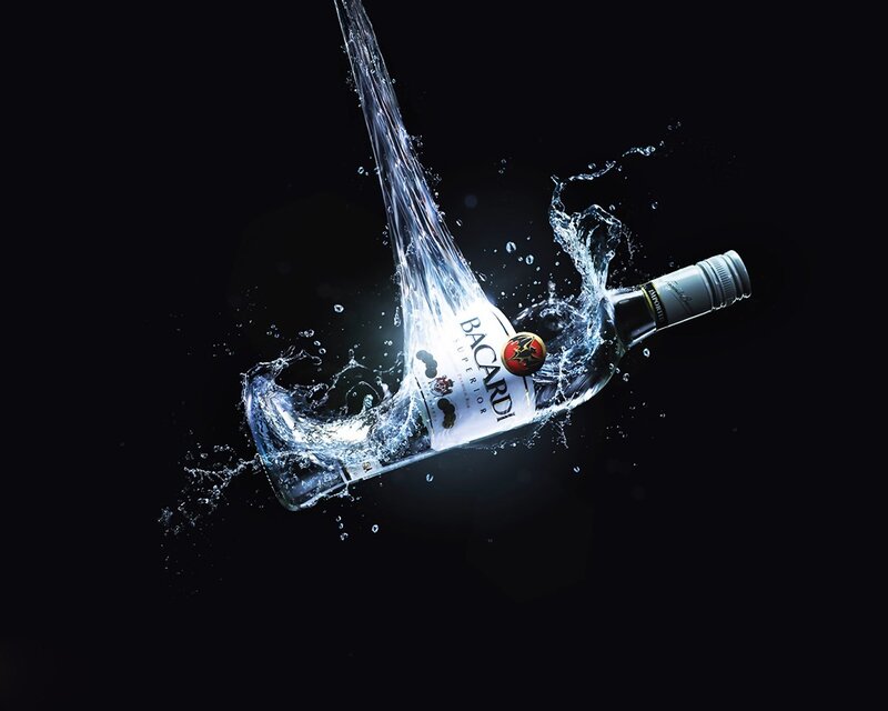 Bacardi bottle in water splash