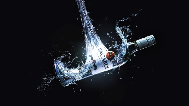 Bacardi bottle in water splash