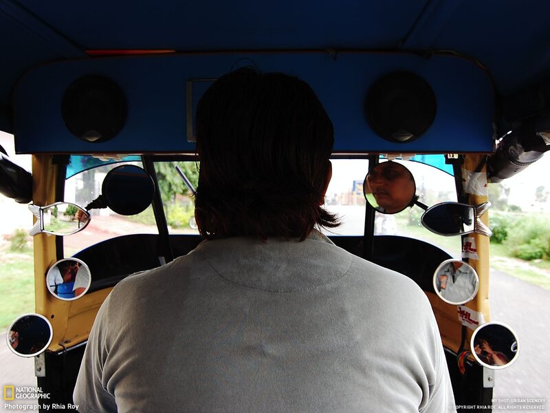 Back of passenger in auto-rickshaw