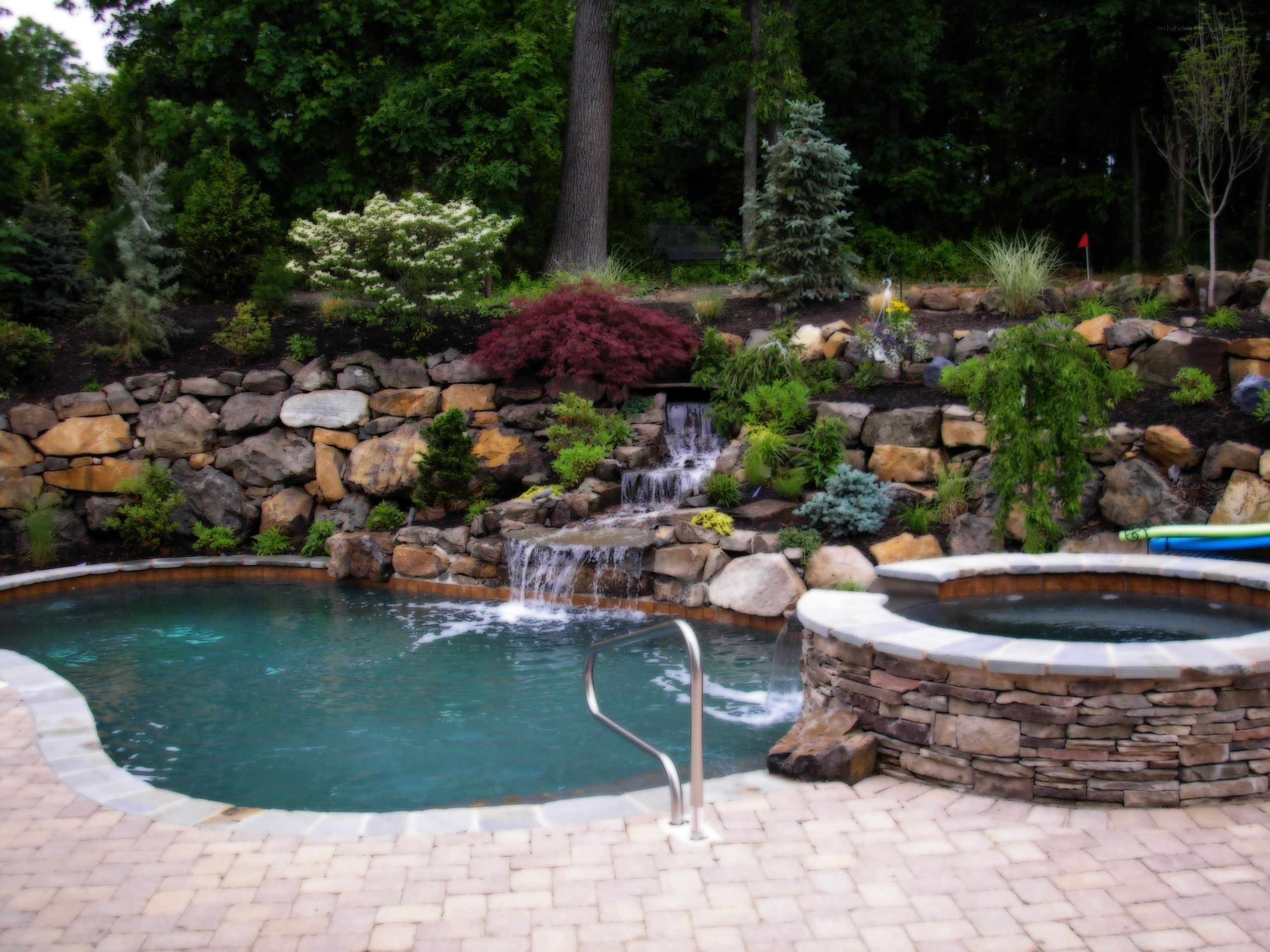Backyard pool with waterfall