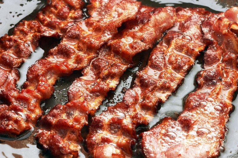 Bacon Cooking in Pan — Brown