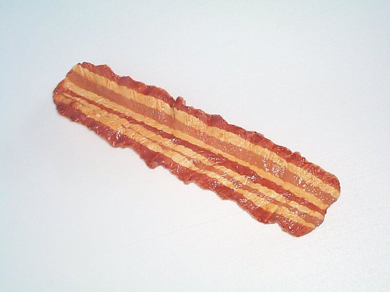 Bacon strip on white surface