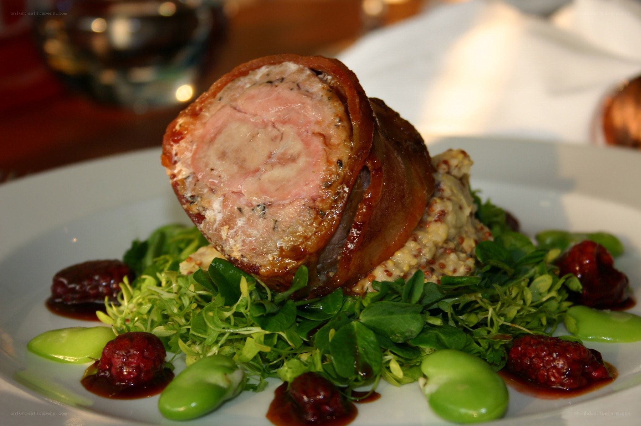 Bacon-wrapped meat roll with salad