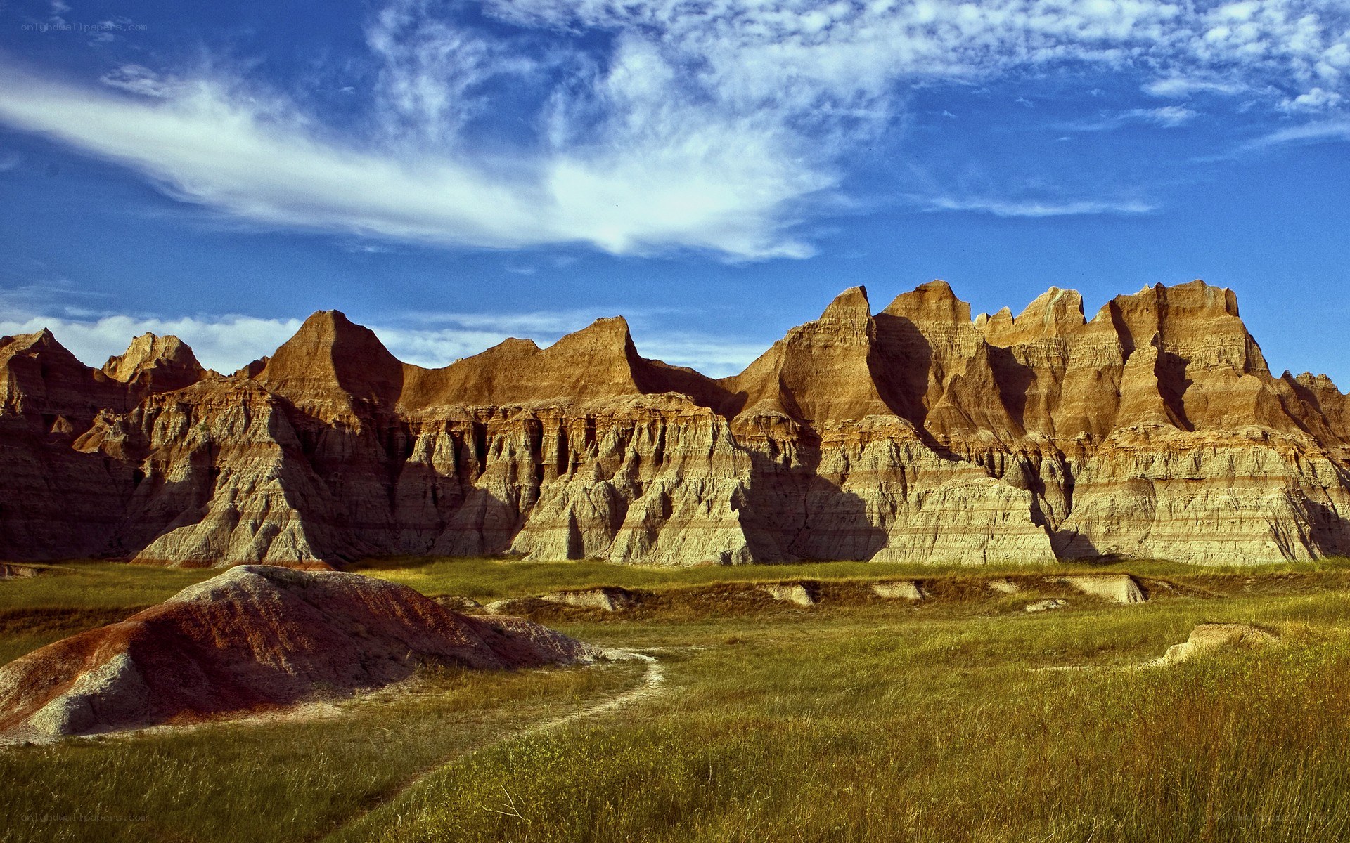 Badlands landscape under blue sky