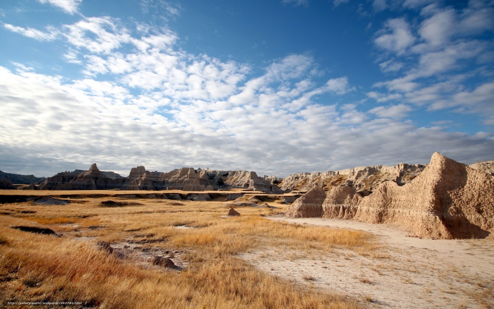 Badlands landscape under blue sky