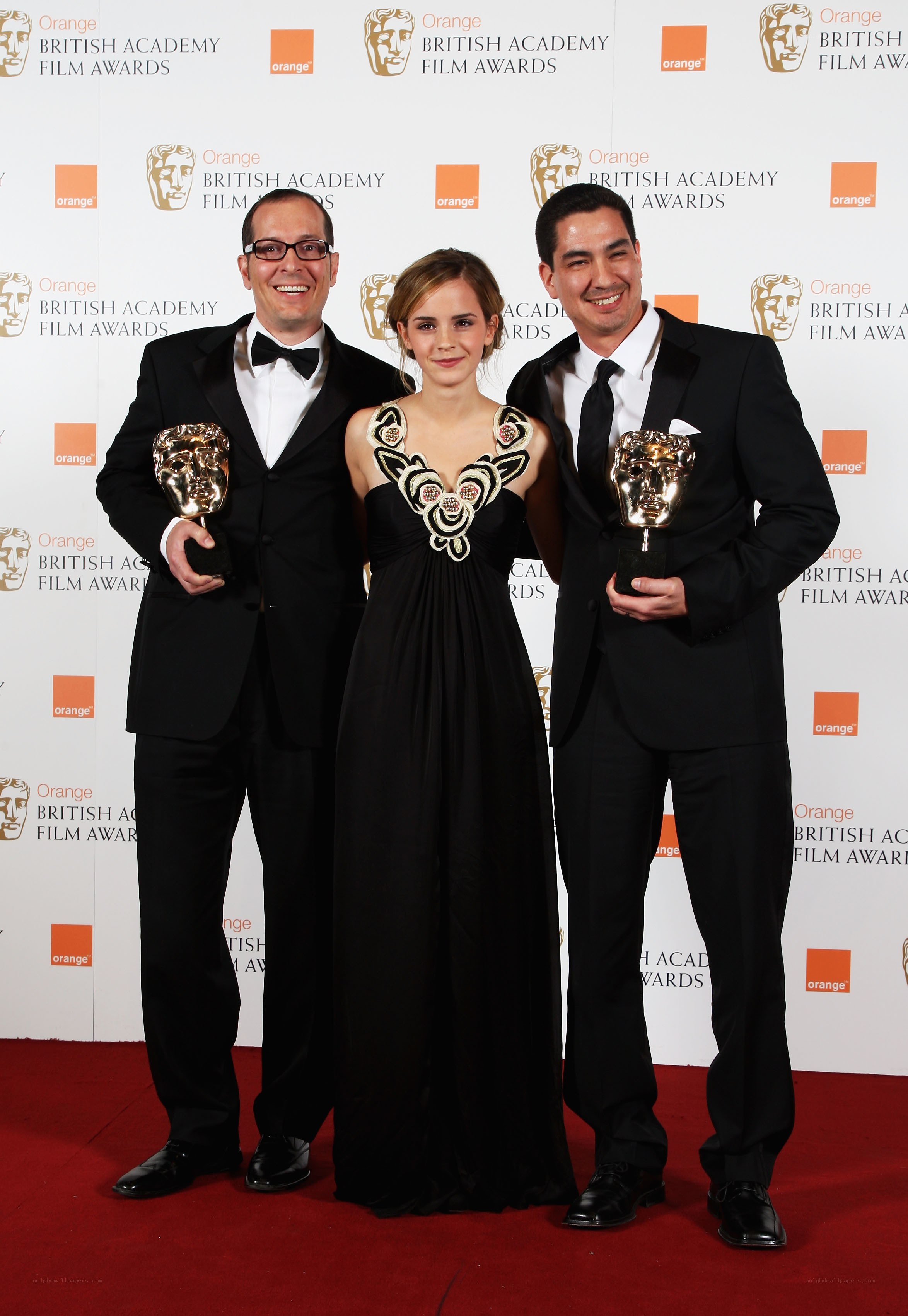 BAFTA award winners pose on red carpet