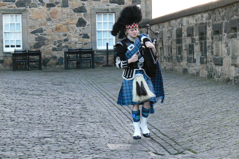 Bagpiper in traditional Scottish attire