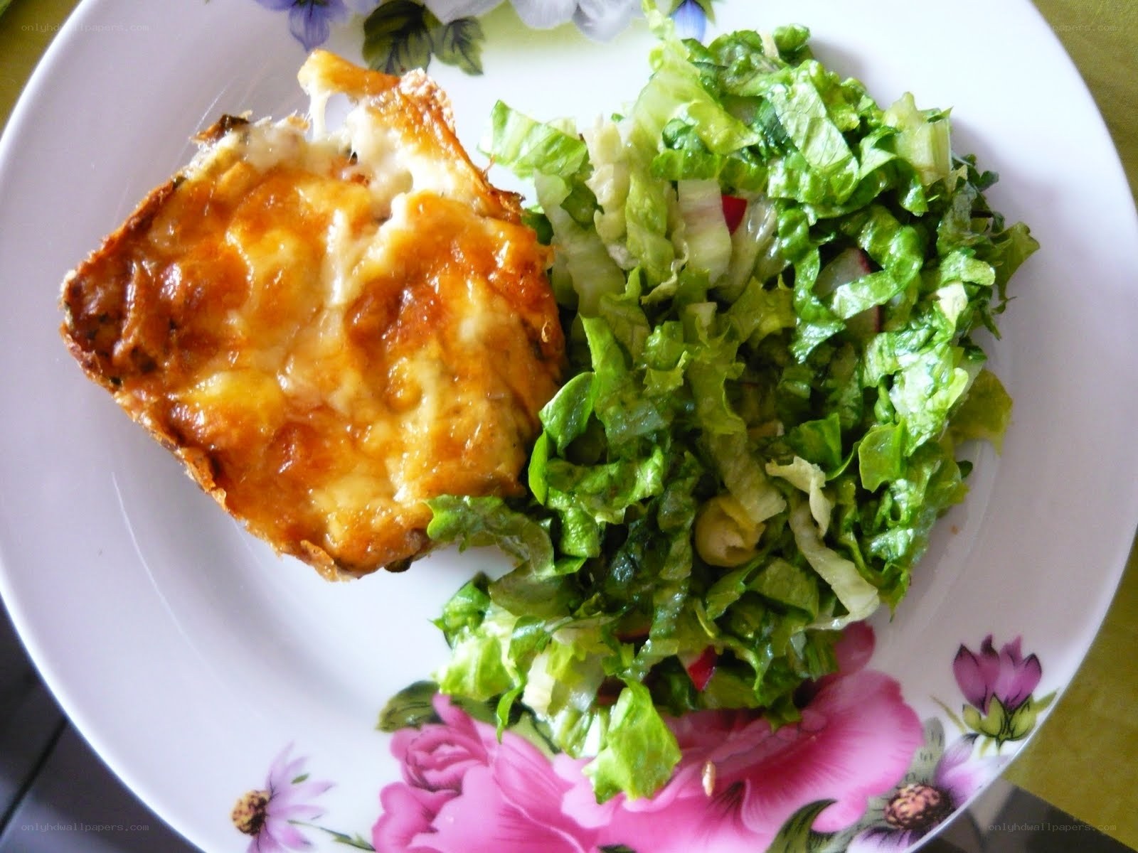 baked dish with salad