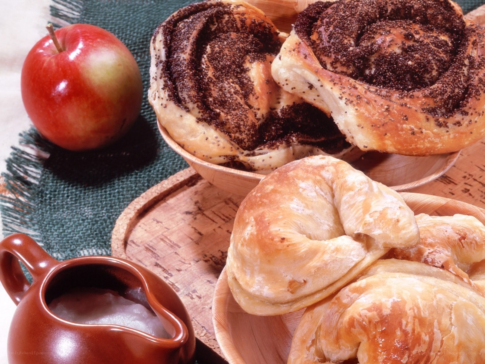 Baked goods and apple on table