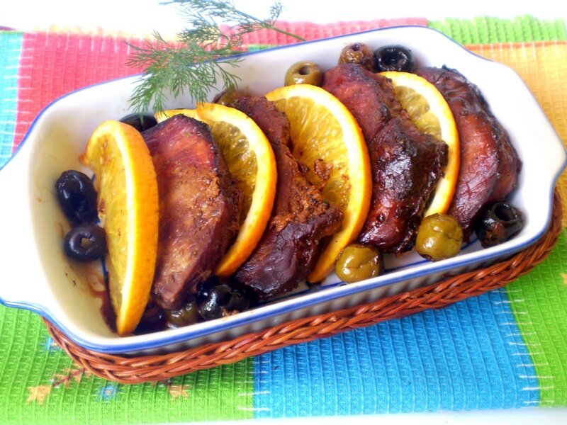 Baked meat with oranges and olives