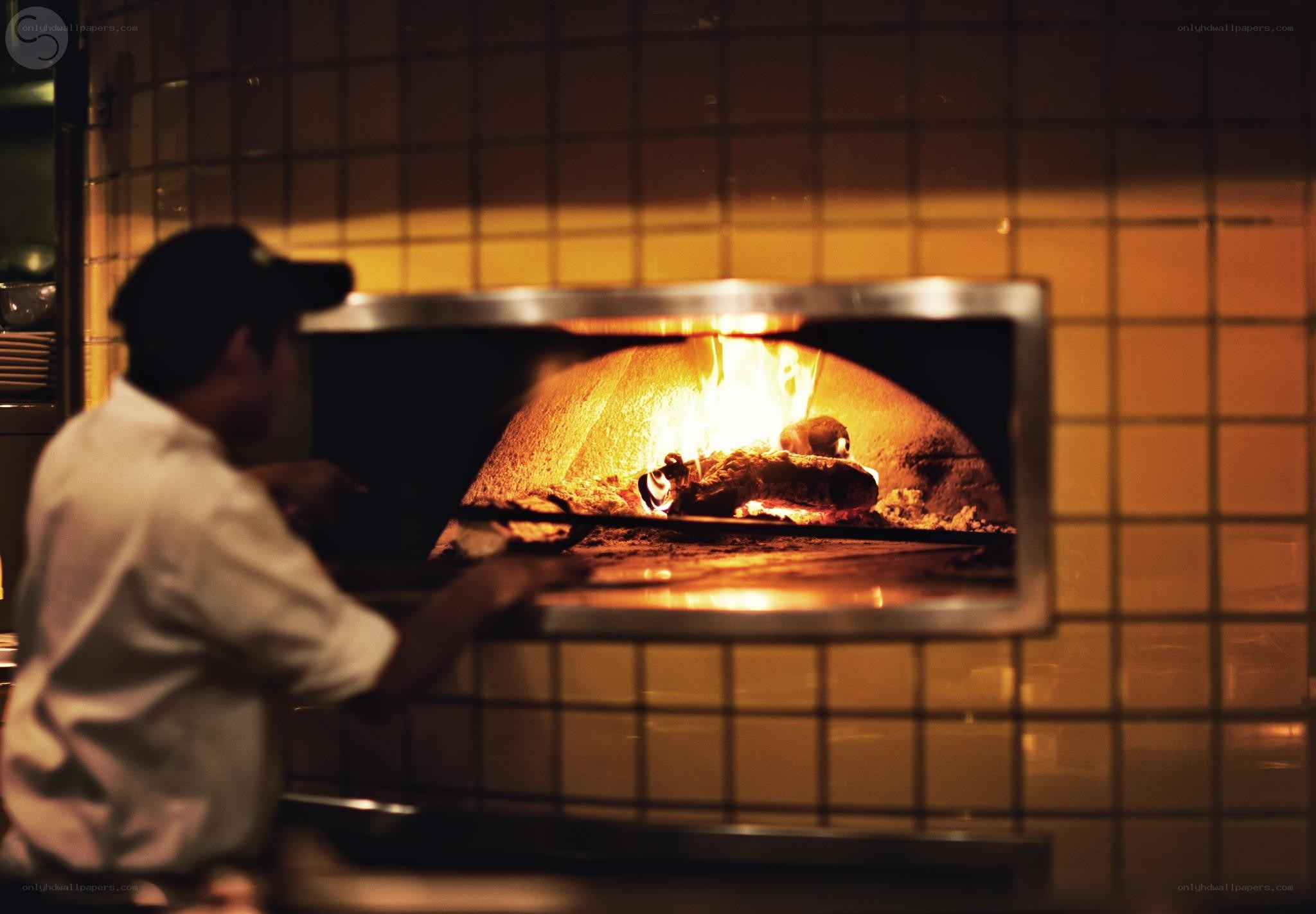 Baker at wood-fired oven