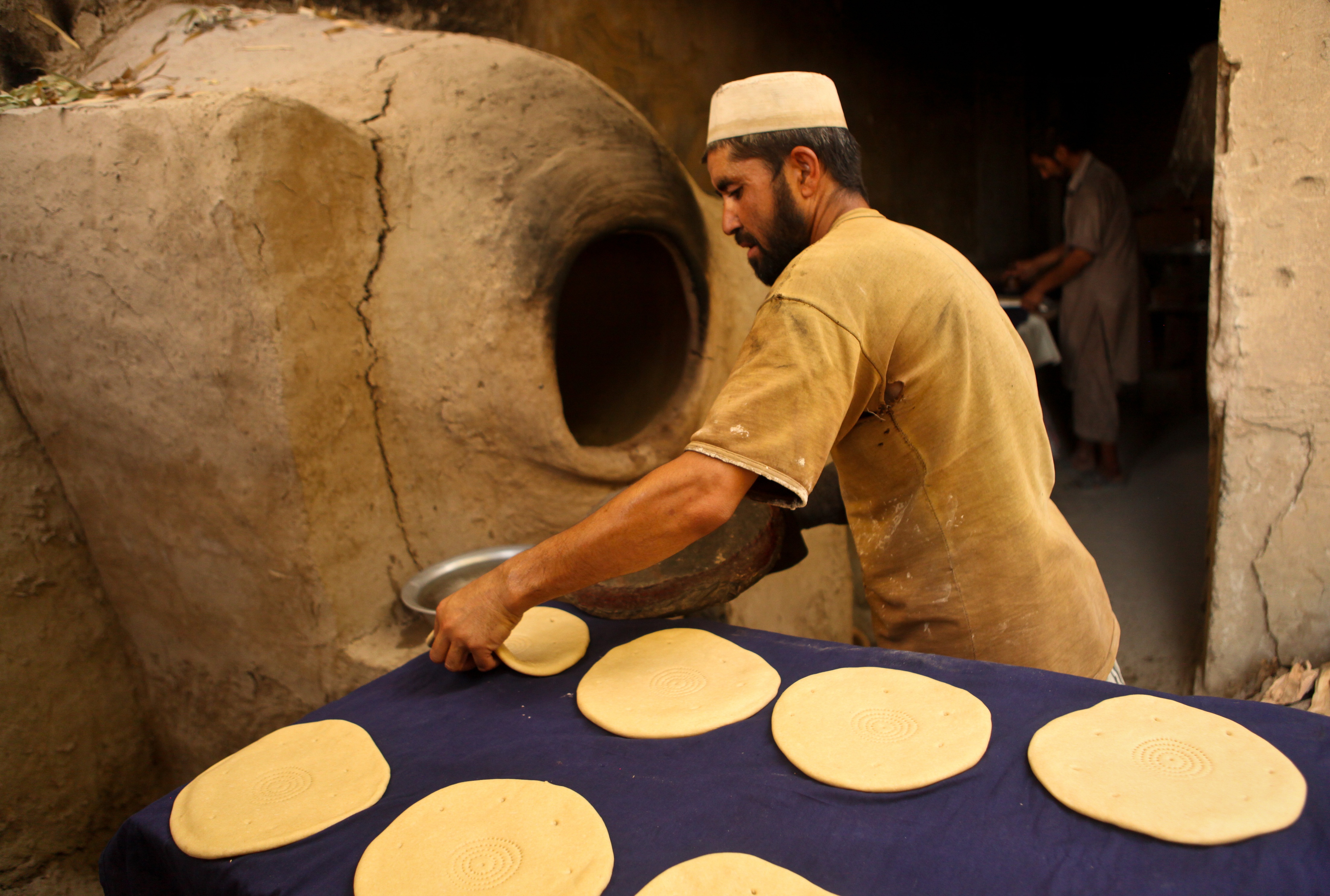 Baker preparing flatbreads