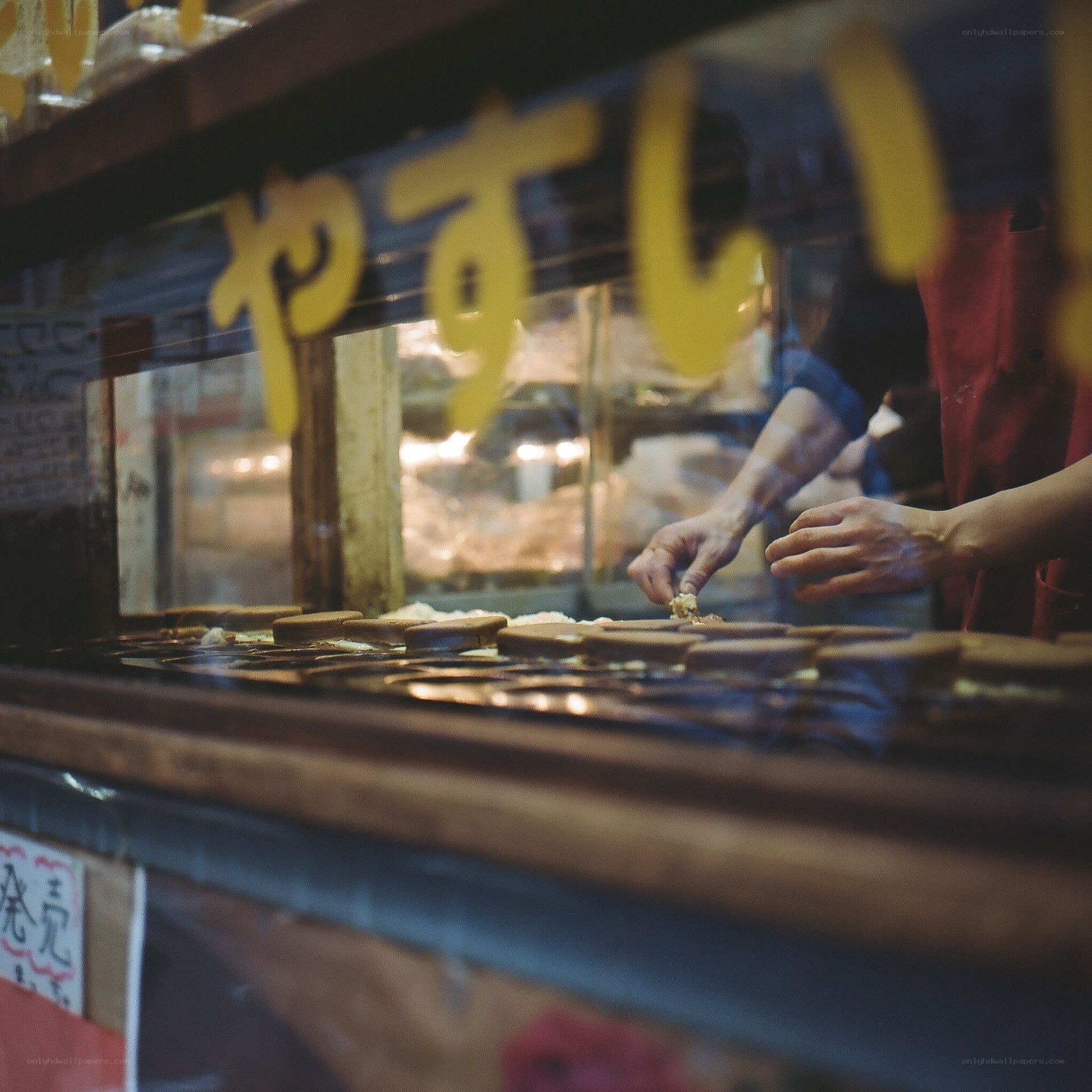 Baker preparing pastries at a shop