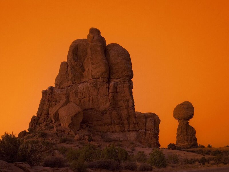 Balanced rock formations at sunset