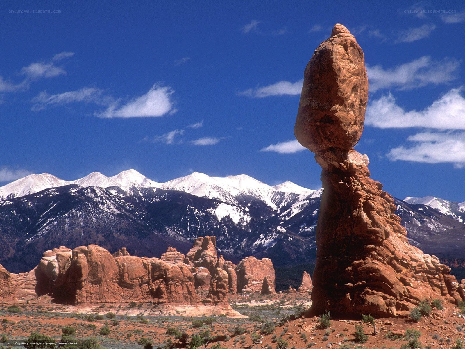 Balanced rock in desert landscape