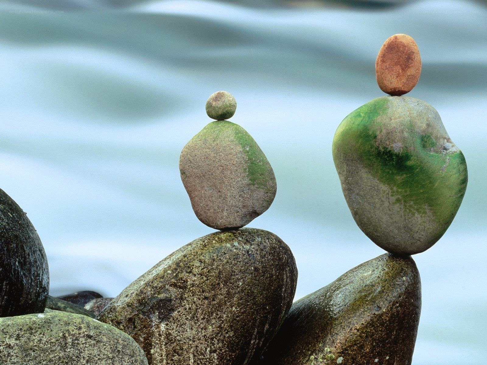 Balanced rocks by the water