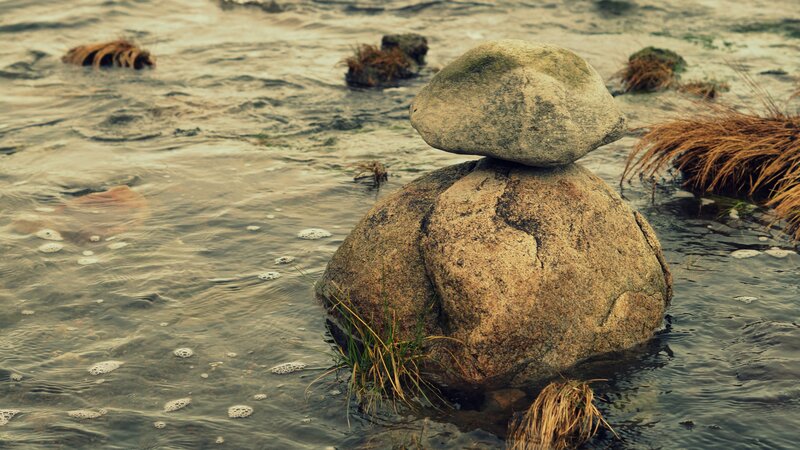 Balanced rocks in flowing water