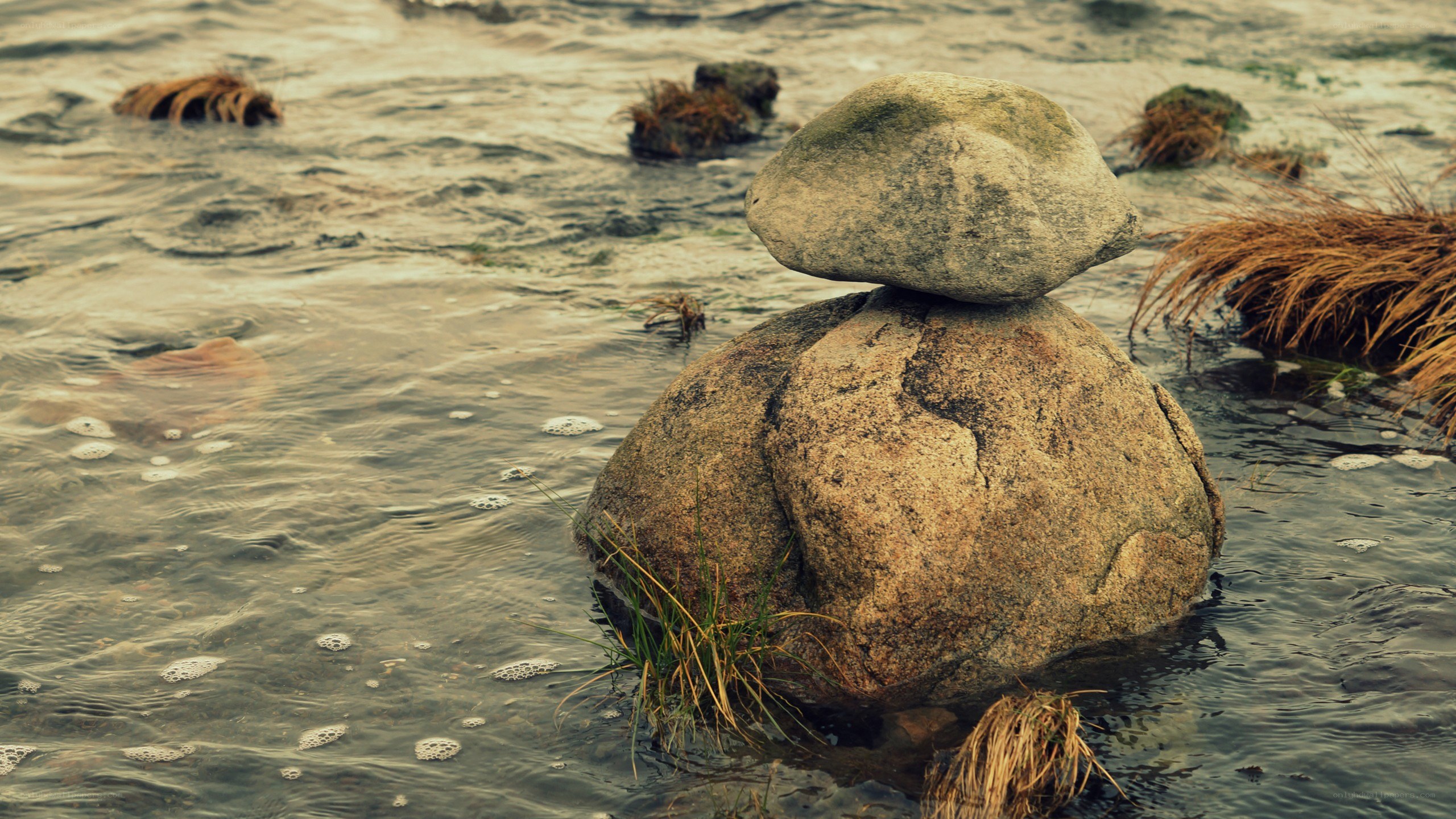 Balanced rocks in flowing water
