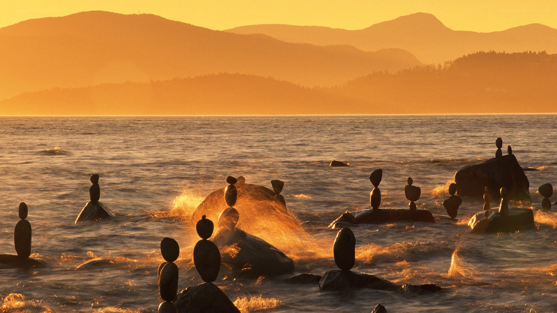 Balanced stones at sunset
