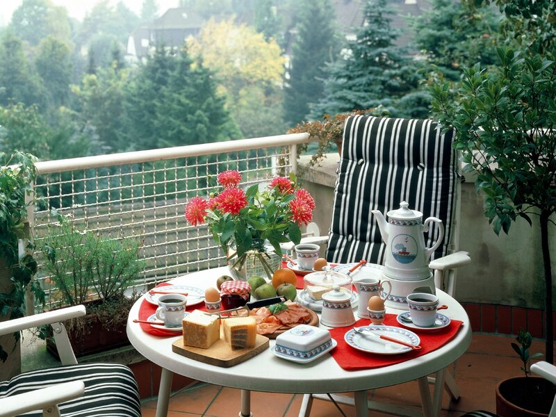 Balcony breakfast with flowers