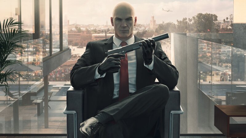 Bald Man Holding Gun — Black, Serious