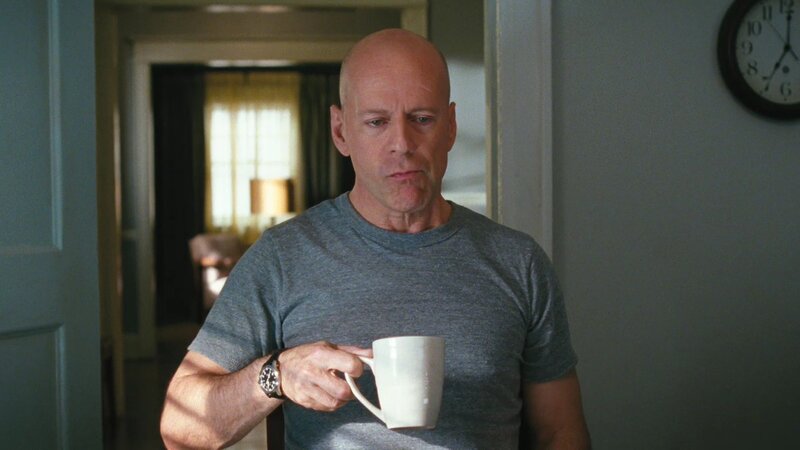 Bald Man Holding Mug