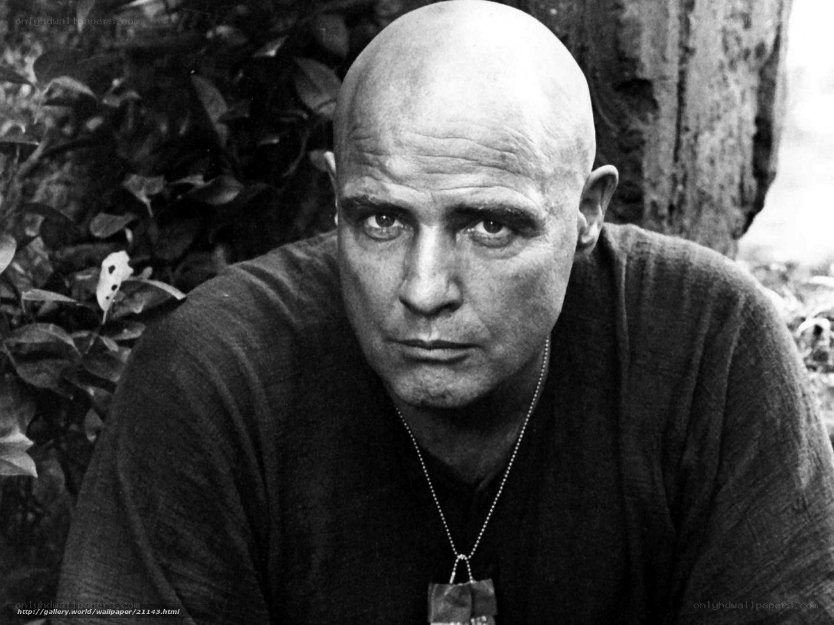 Bald man in black and white