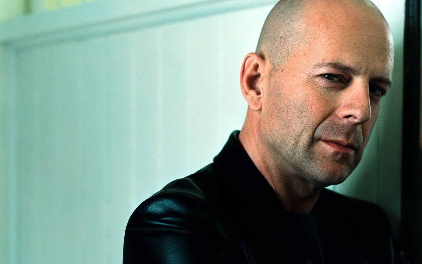 Bald man in black leather