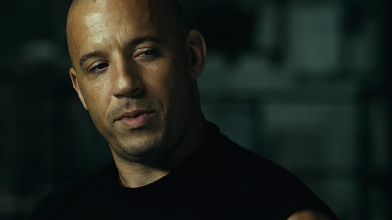 Bald Man in Black Shirt — Serious