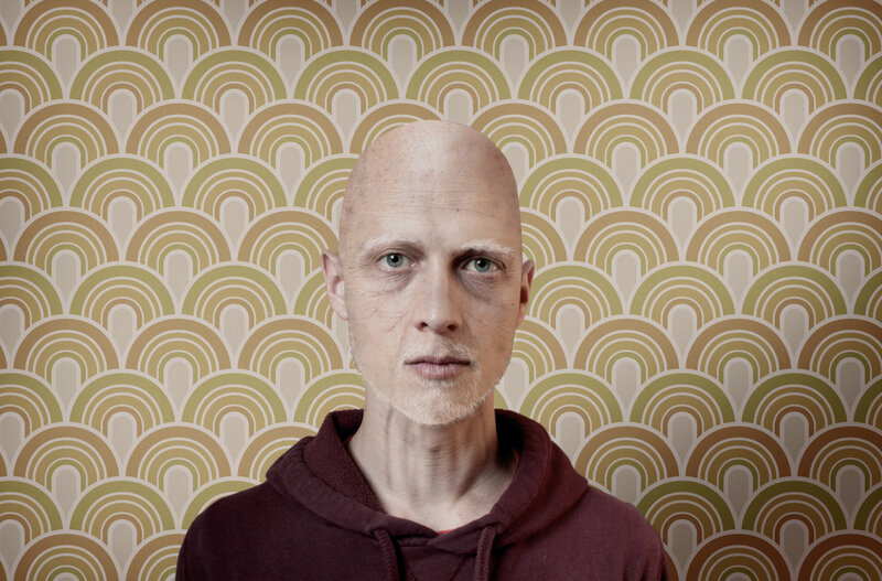 Bald Man in Hoodie