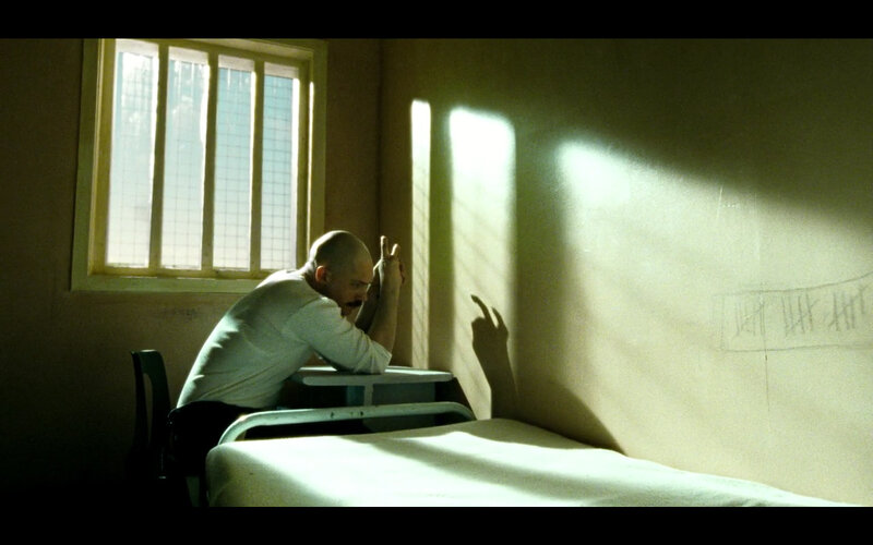Bald Man in Prison Cell