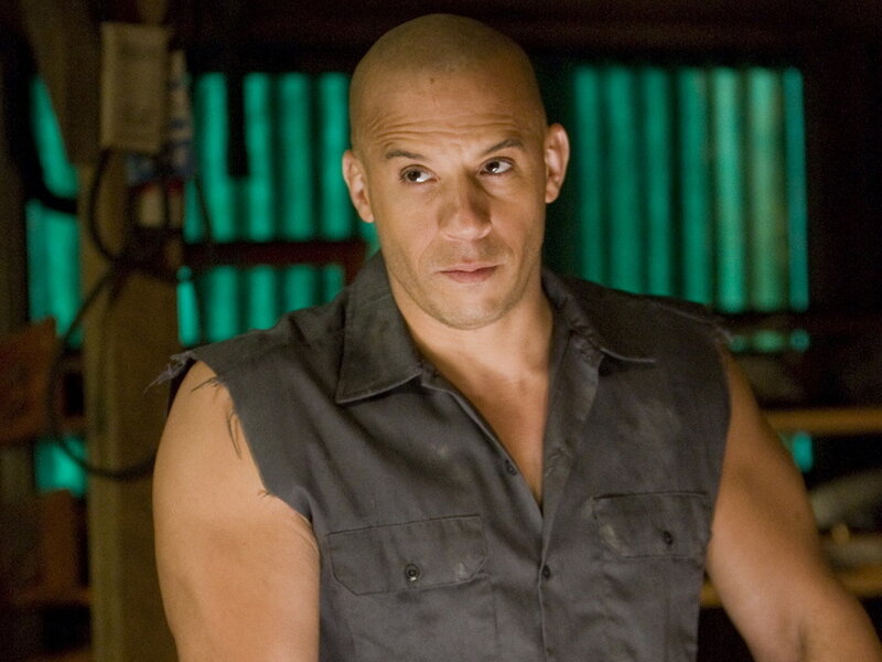 Bald Man in Sleeveless Shirt