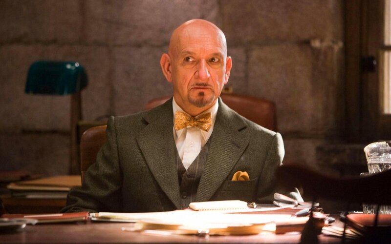Bald Man in Suit — Gray, Serious