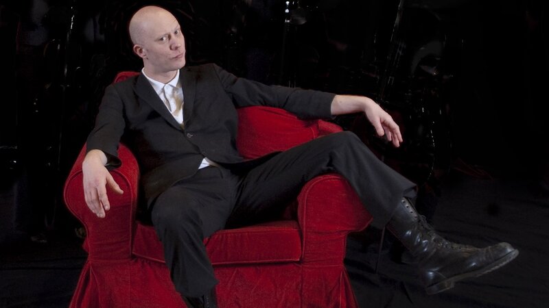 Bald Man in Suit — Red, Dramatic