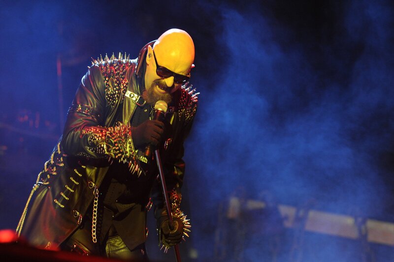 Bald Man Singing on Stage