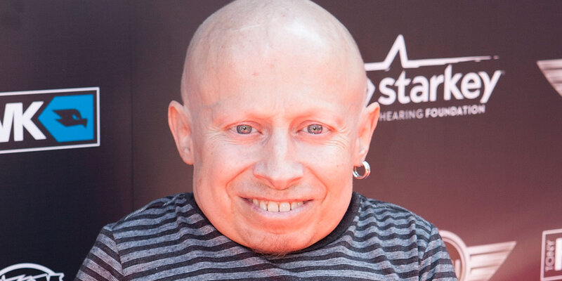 Bald man smiling at event