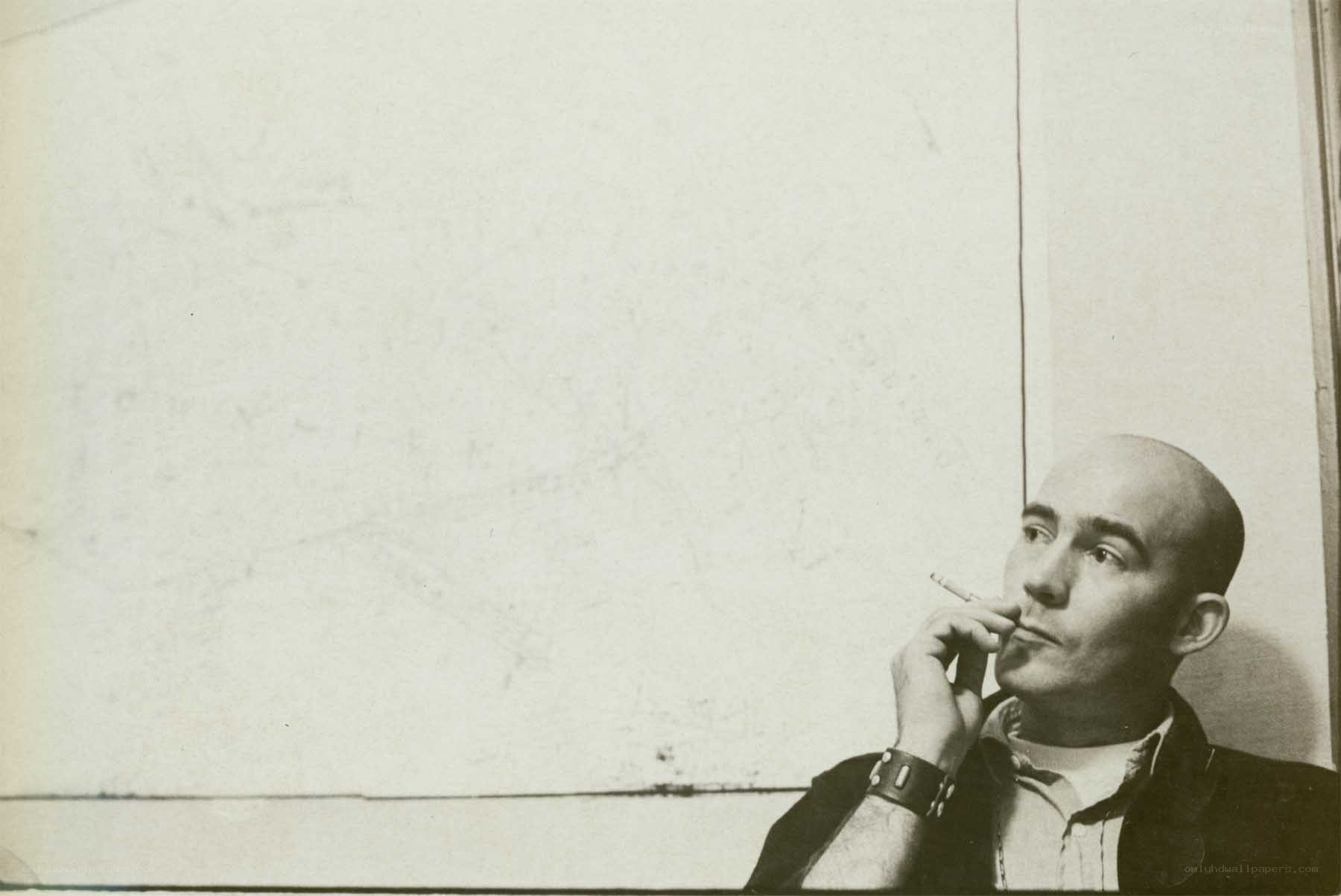Bald man smoking cigarette
