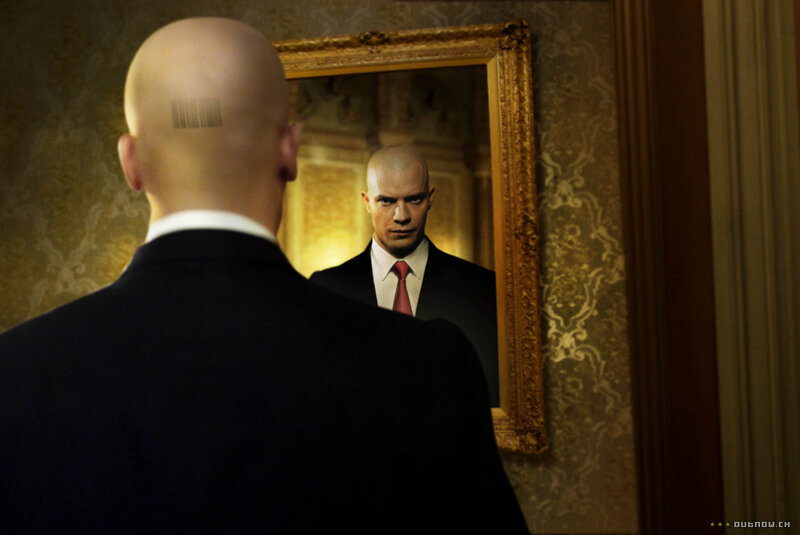 bald man with barcode on head