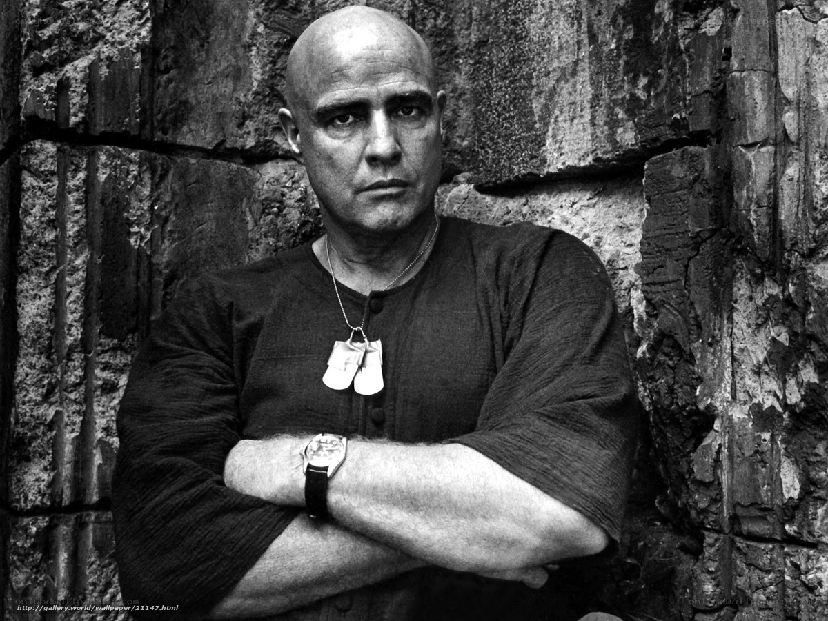 Bald man with dog tags