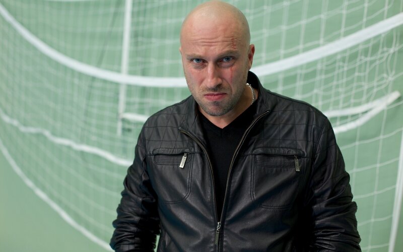 Bald Man with Injury