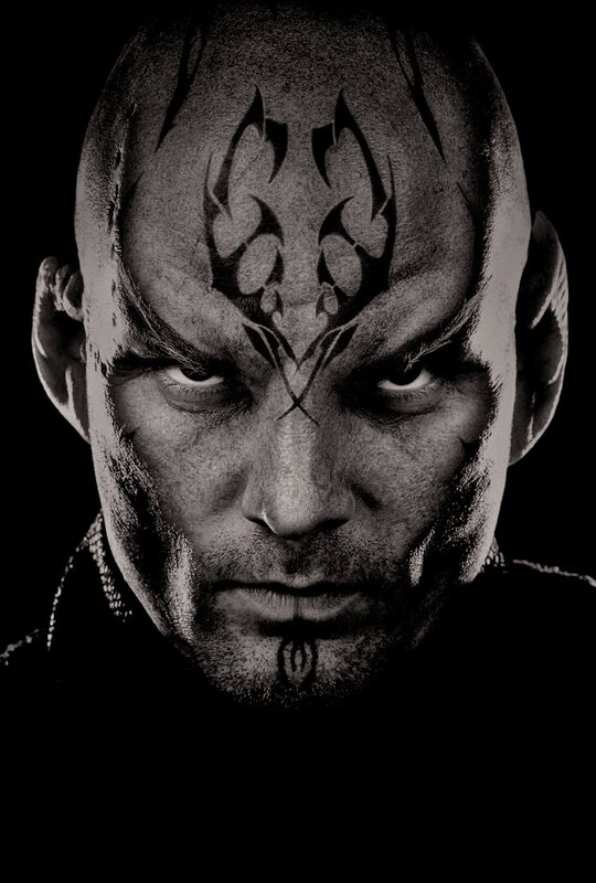bald man with tribal face paint
