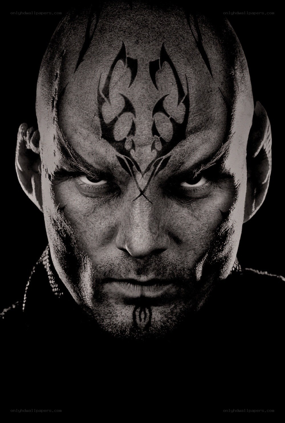 bald man with tribal face paint