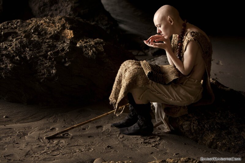 bald monk in cave