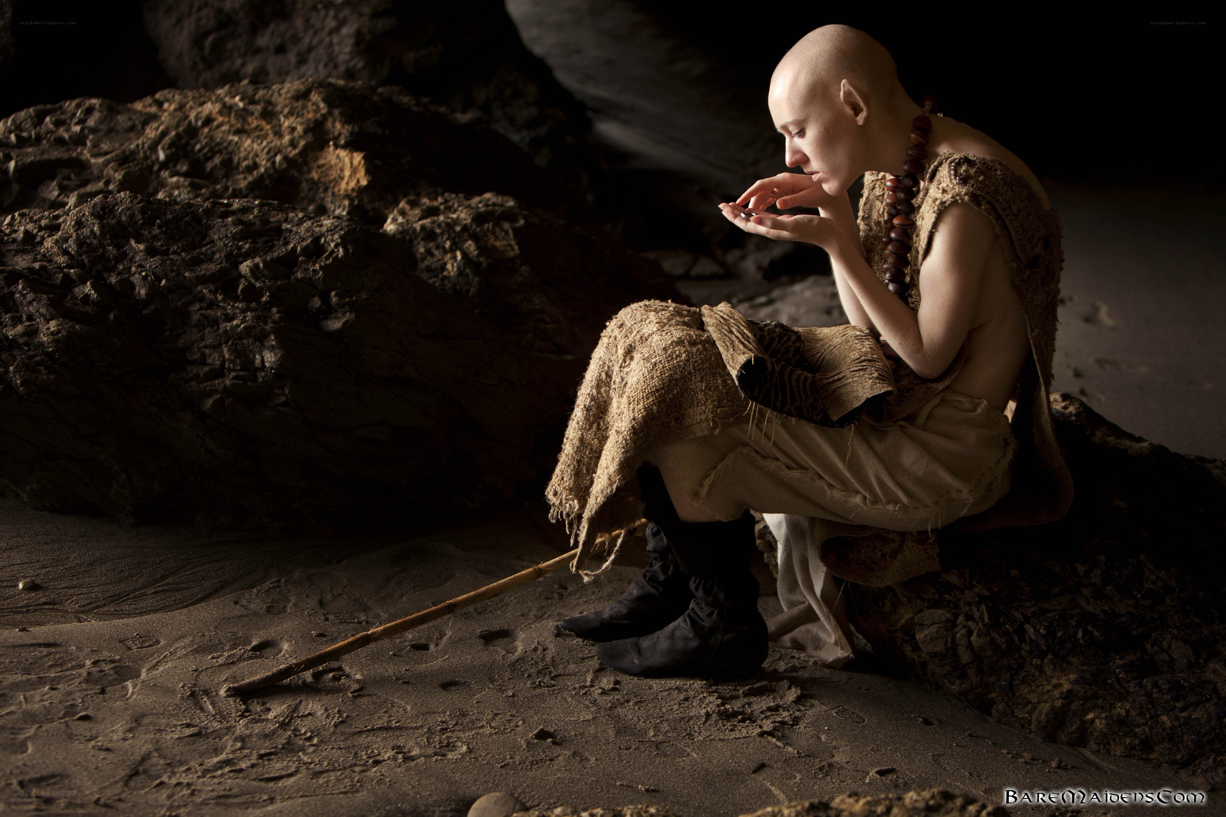 bald monk in cave
