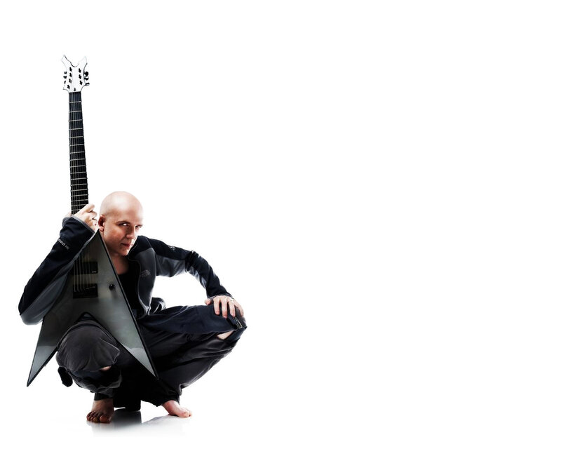 Bald musician with guitar