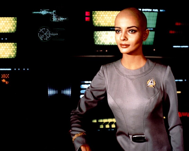 Bald woman in starfleet uniform