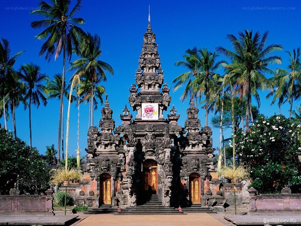 Balinese temple with palm trees
