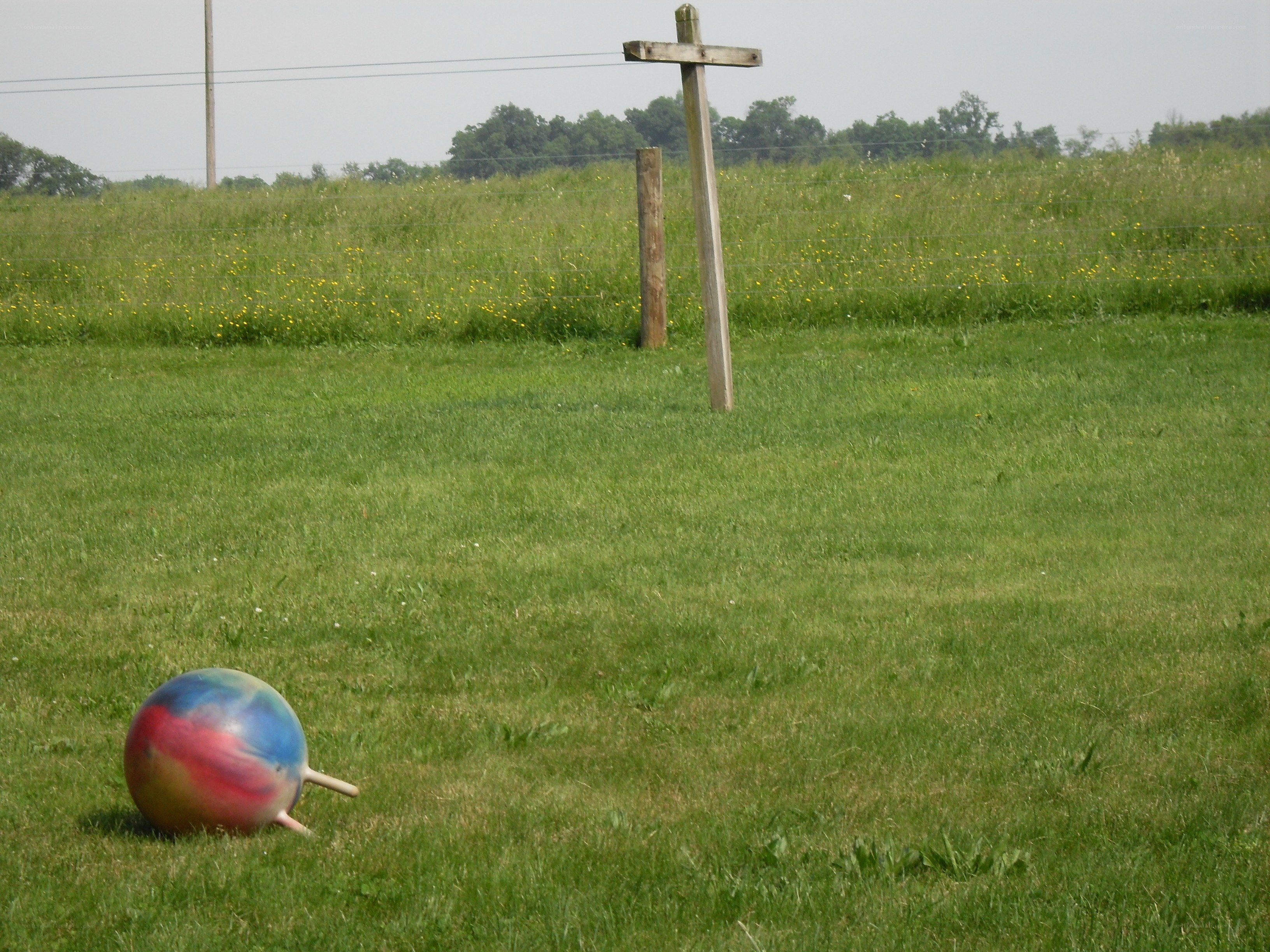 Ball and cross in a field